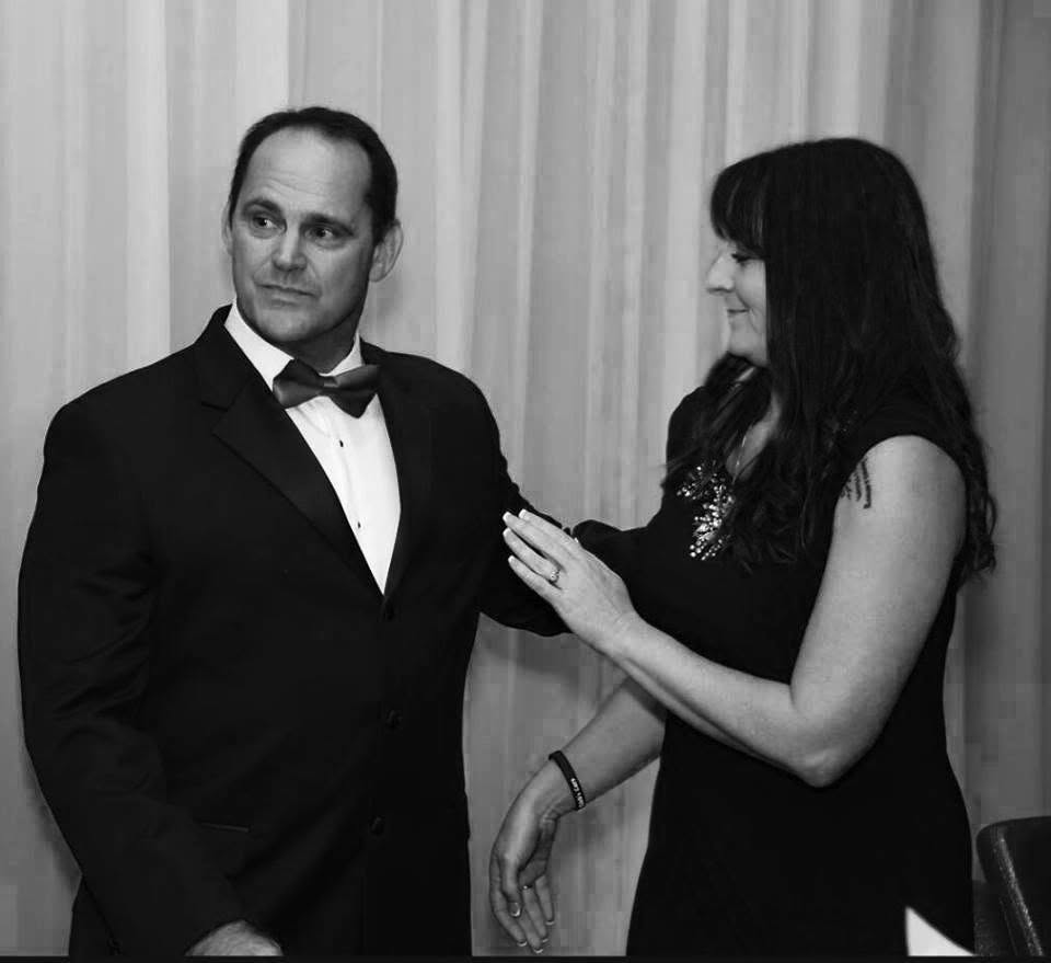 Dave and his wife at a formal event
