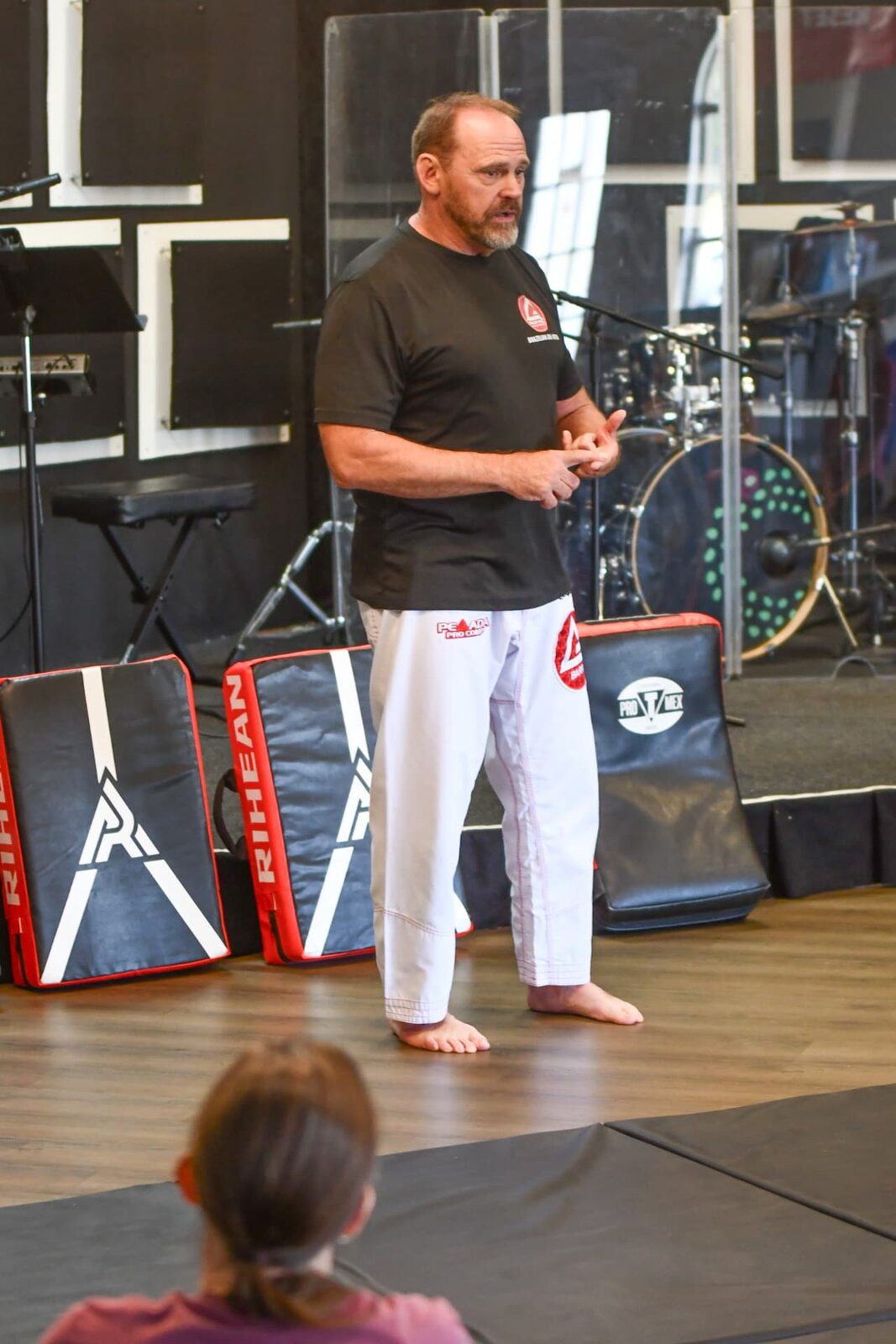 Dave teaching a class on the jiu-jitsu mats
